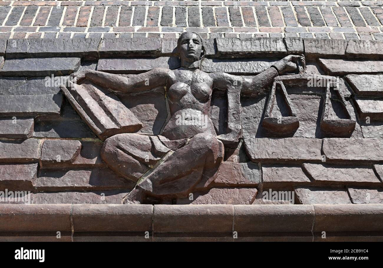 12 August 2020, Saxony, Chemnitz: View of the Justitia above the entrance at the district court of Chemnitz. Here the verdict in the trial of a man accused of two murders is expected. The accused is said to have strangled two brothers with an electric cable in their apartment in the summer of 1995. Both victim and perpetrator were Vietnamese. The background of the crime was illegal cigarette trade and protection racket. After the murder, the man had left for the Czech Republic, where he had lived under false identity. Last year he was arrested in Prague and transferred to Germany. Photo: Hendr Stock Photo