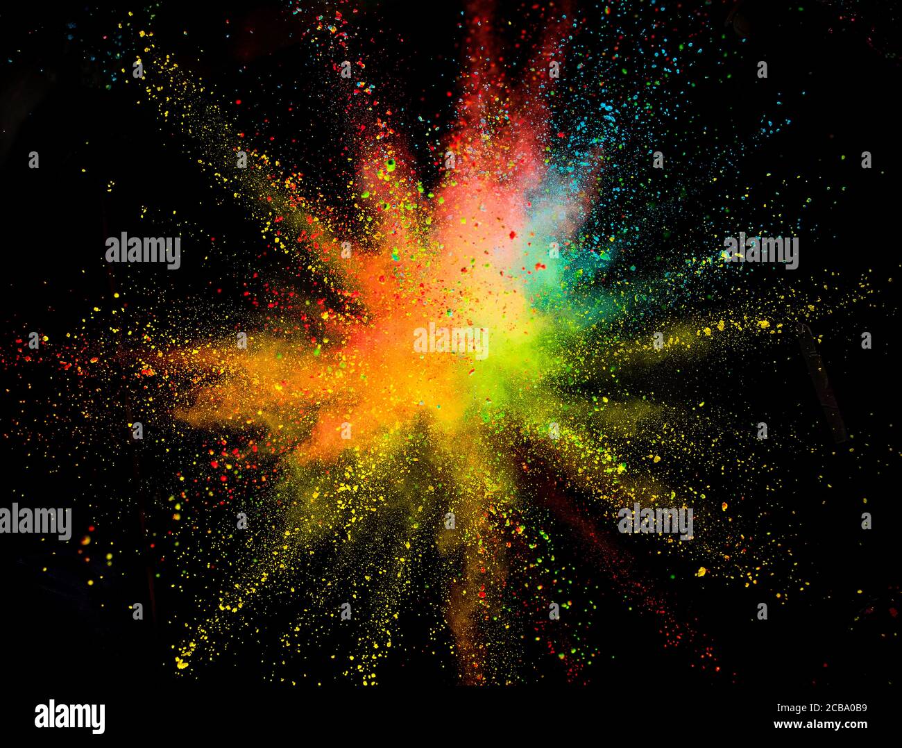 Multi colored powder explosion isolated on black background. Freeze ...