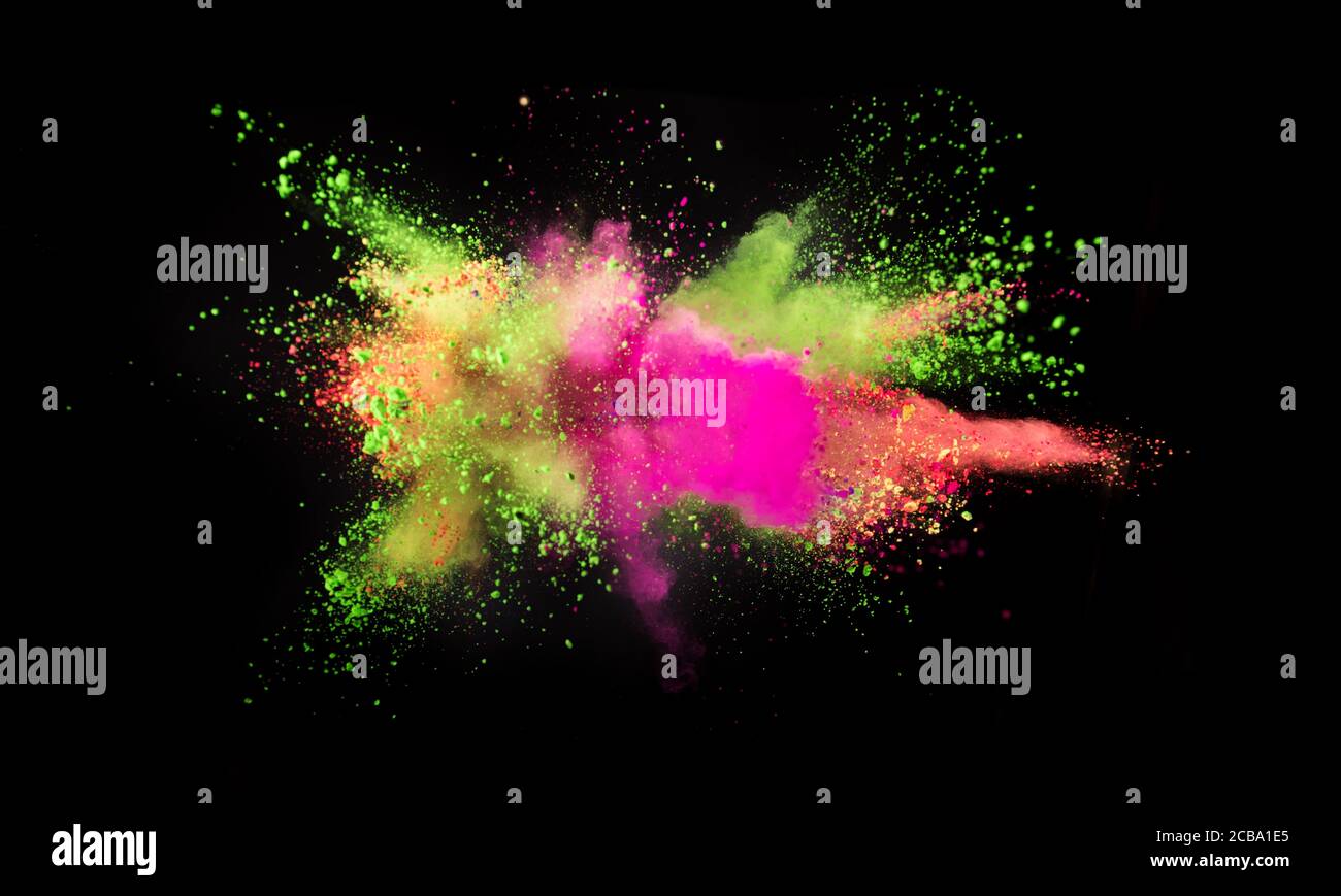 Multi colored powder explosion isolated on black background. Freeze ...