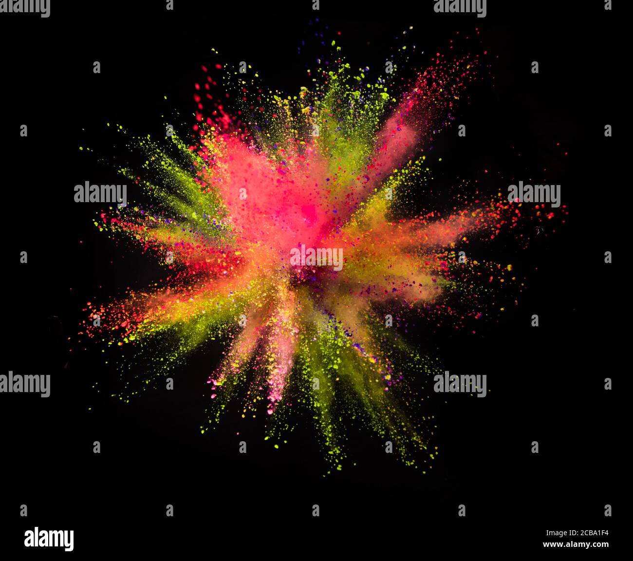Multi colored powder explosion isolated on black background. Freeze ...