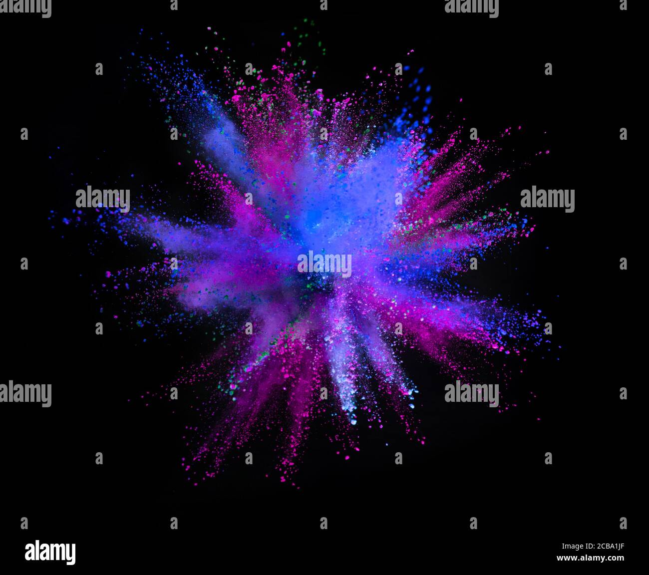 Multi colored powder explosion isolated on black background. Freeze ...