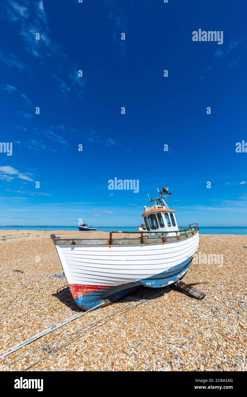 Fishing boats on the shingle beach at Dungeness in Kent, England Stock ...