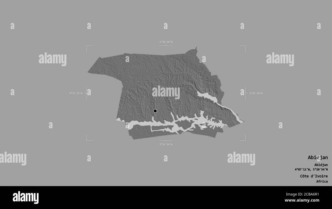 Area of Abidjan, autonomous district of Côte d'Ivoire, isolated on a solid background in a georeferenced bounding box. Labels. Bilevel elevation map. Stock Photo