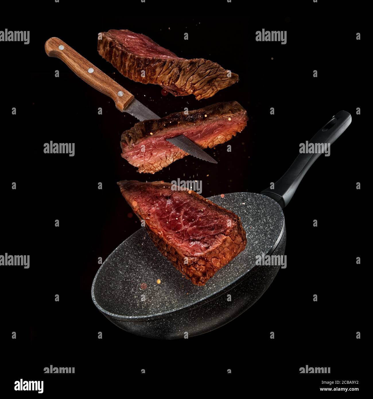 https://c8.alamy.com/comp/2CBA9Y2/flying-pieces-of-beef-steaks-from-pan-isolated-on-black-background-concept-of-flying-food-very-high-resolution-image-2CBA9Y2.jpg