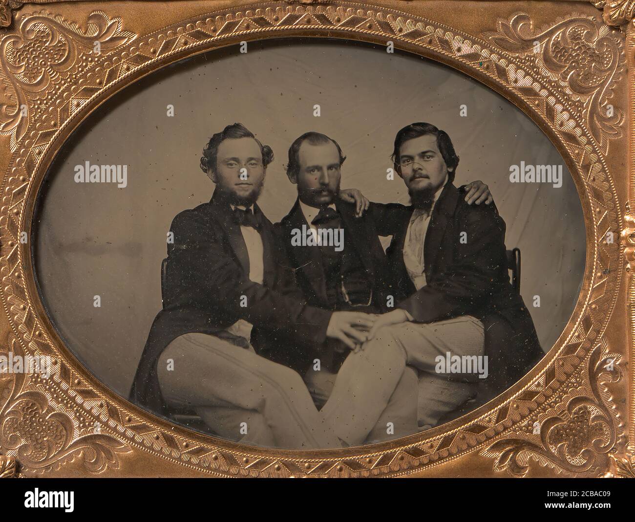 Three Seated Men with Arms Around Each Other, 1860s Stock Photo - Alamy