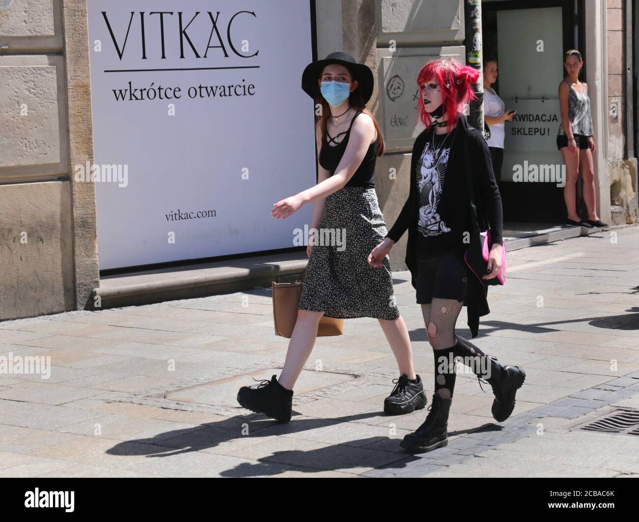 Cracow. Krakow. Poland. Young girls wearing goth outfits and mask