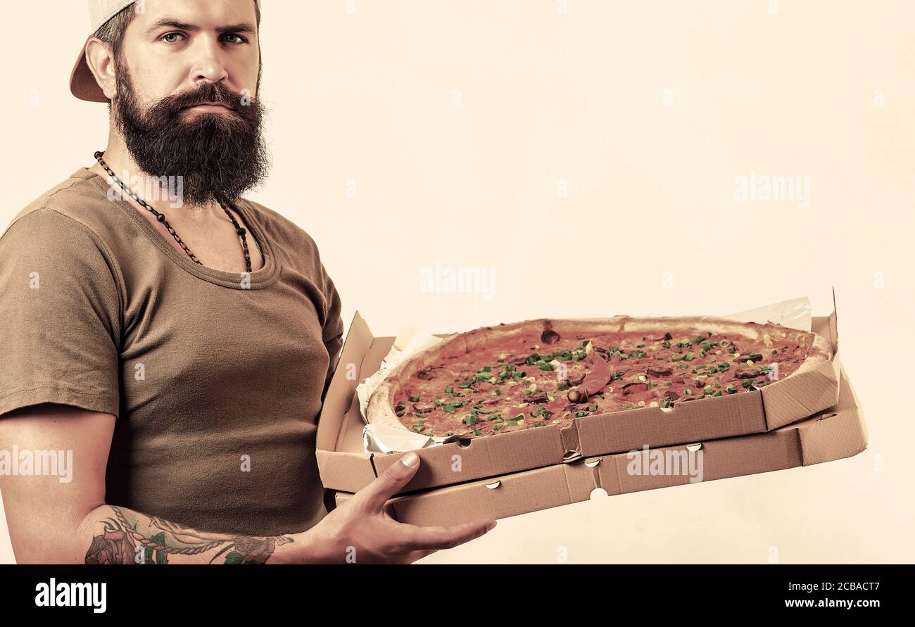 Pizza delivery concept. young man holding pizzas Stock Photo - Alamy