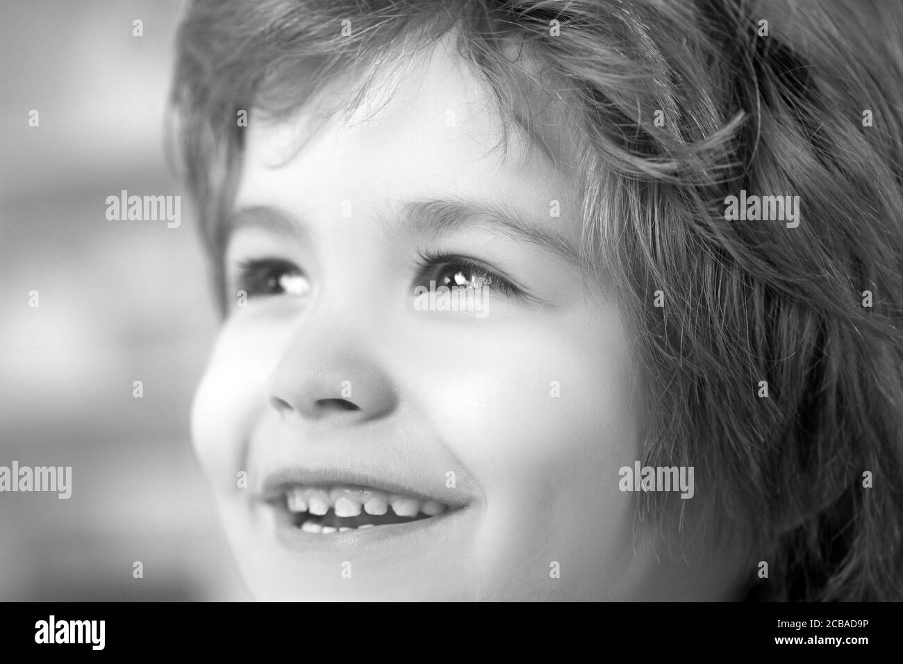 Portrait of kid surprised and curious face. Stock Photo