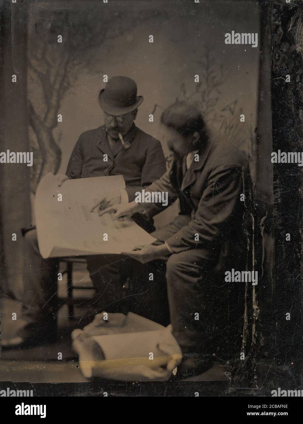 Two Men Reviewing Plans, 1860s-70s. Stock Photo