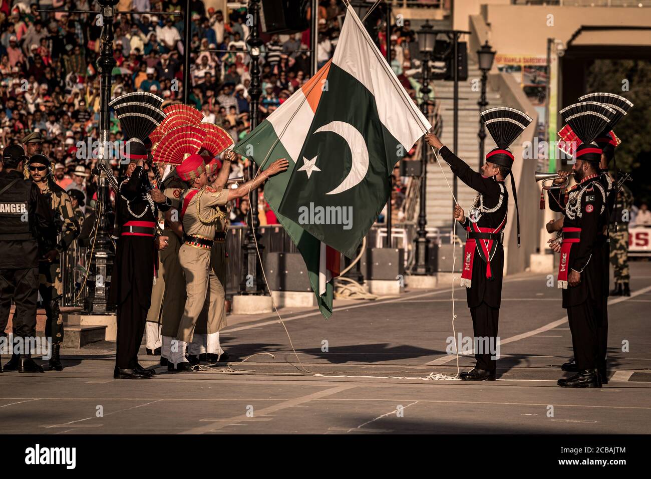 At The Indian-Pakistan Border In Wagah, A Military Parade Of The Border  Soldiers Is Held Every Evening On Both Sides, Which Includes The Flag  Parade And The Sound Of The Signal Trumpet