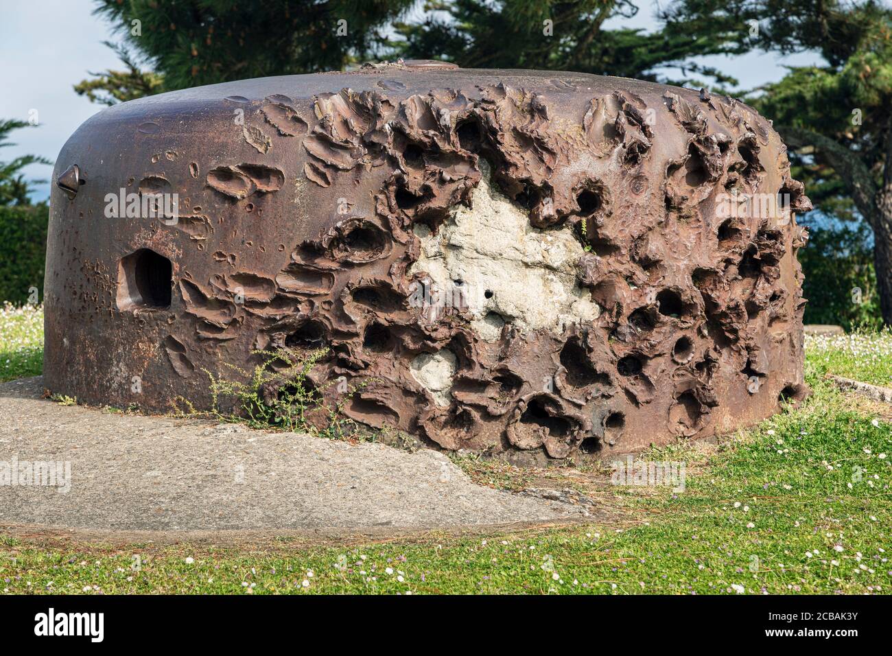 On a headland at Cité d'Alet, Saint-Malo, these German gun emplacements show the scars inflicted by invading allied forces during the Second World War Stock Photo