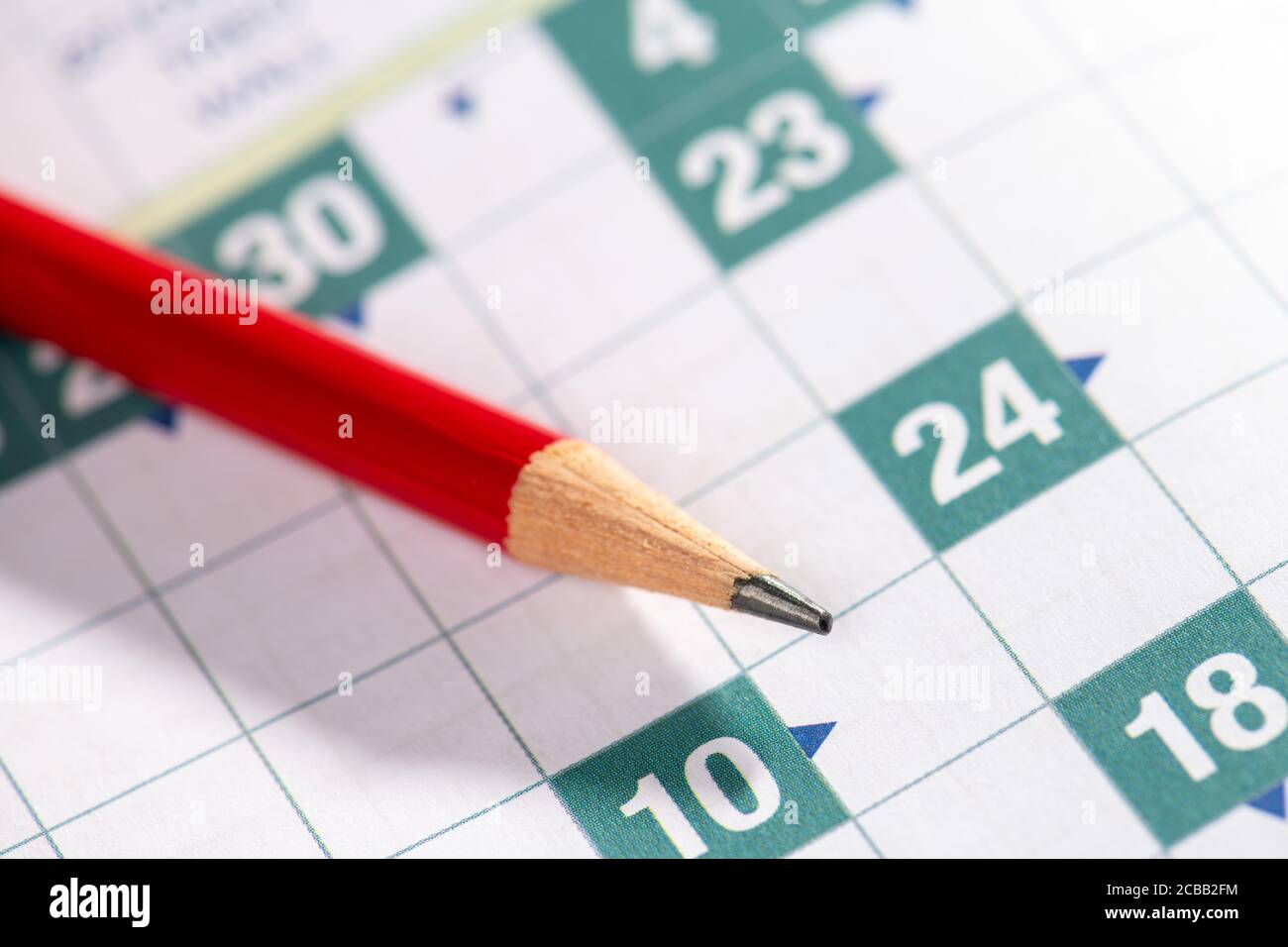 red pencil lies on crossword puzzle Stock Photo