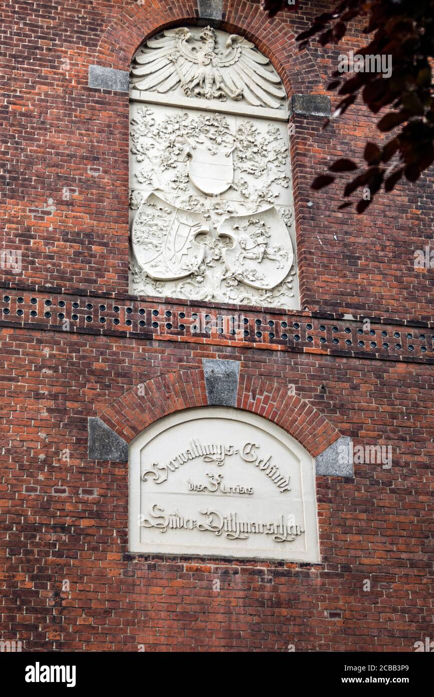 On the outer wall of the district court of Meldorf an old inscription: Administration building of the district of South-Dithmarschen Stock Photo