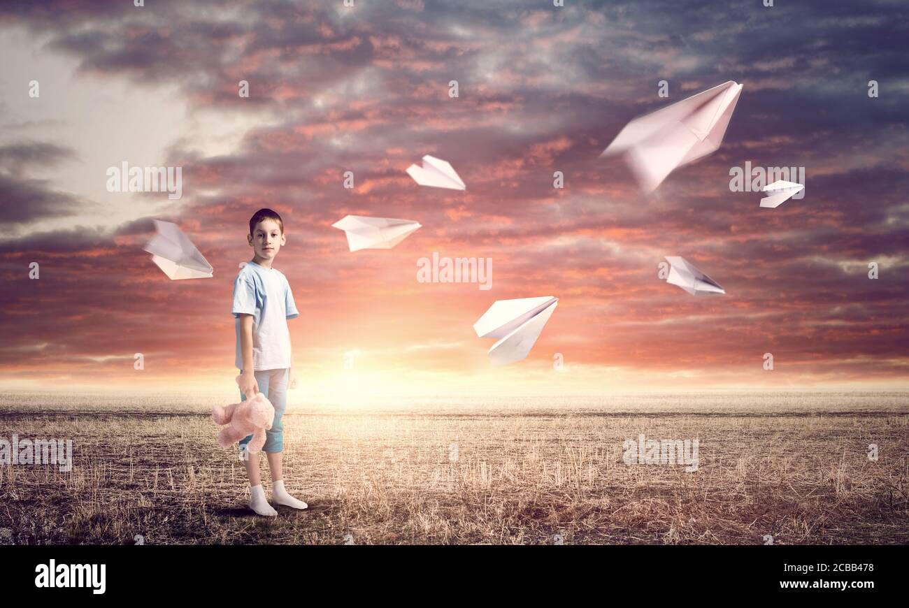 Boy with bear toy Stock Photo - Alamy