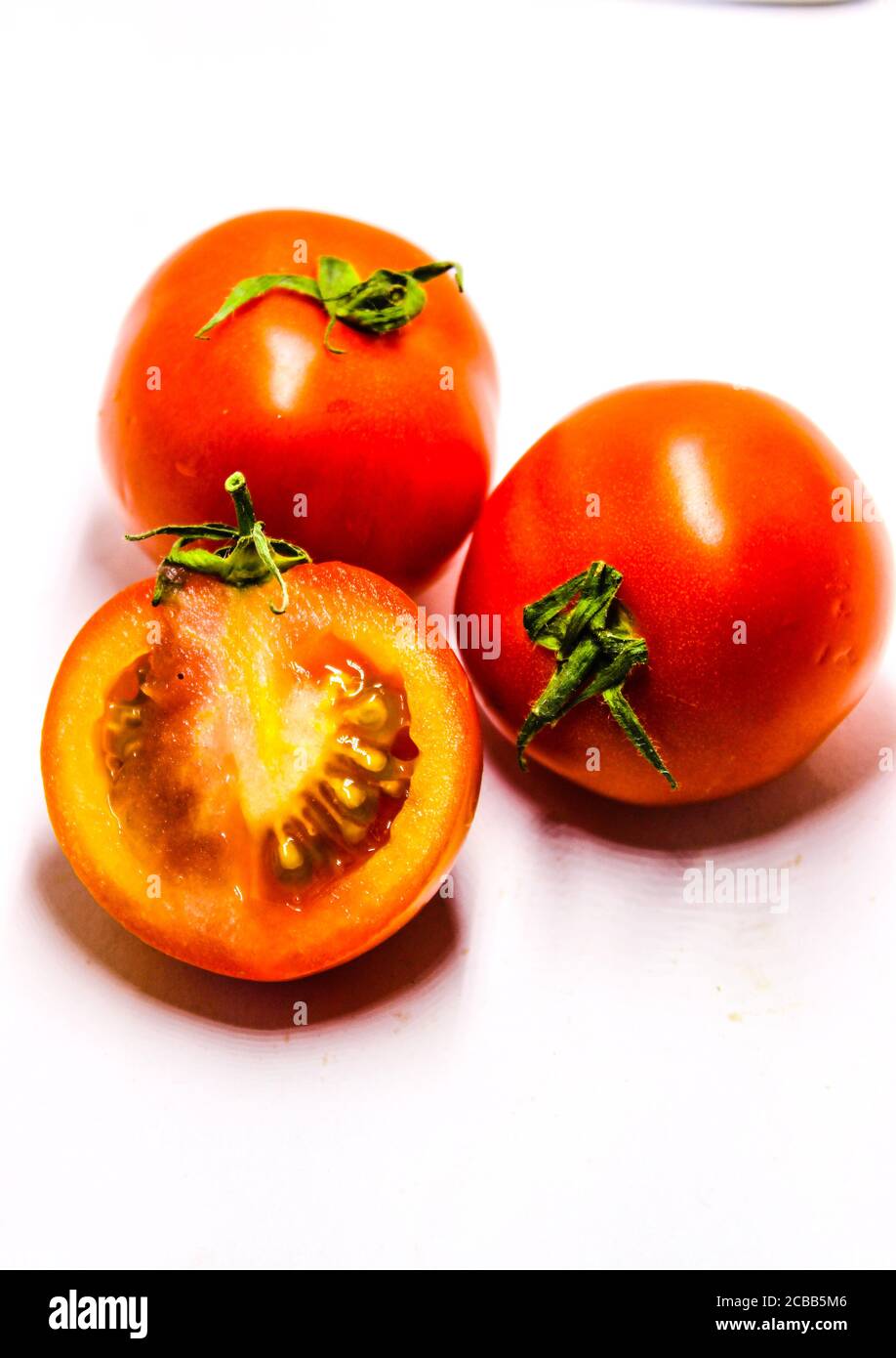 A picture of fresh tomato's with white background Stock Photo - Alamy