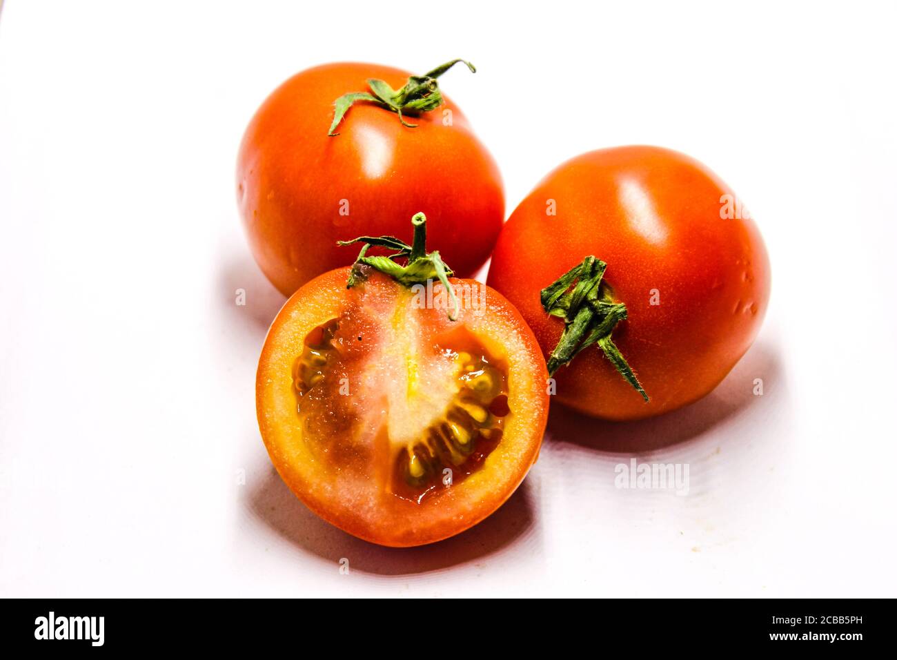 A picture of fresh tomato's with white background Stock Photo - Alamy