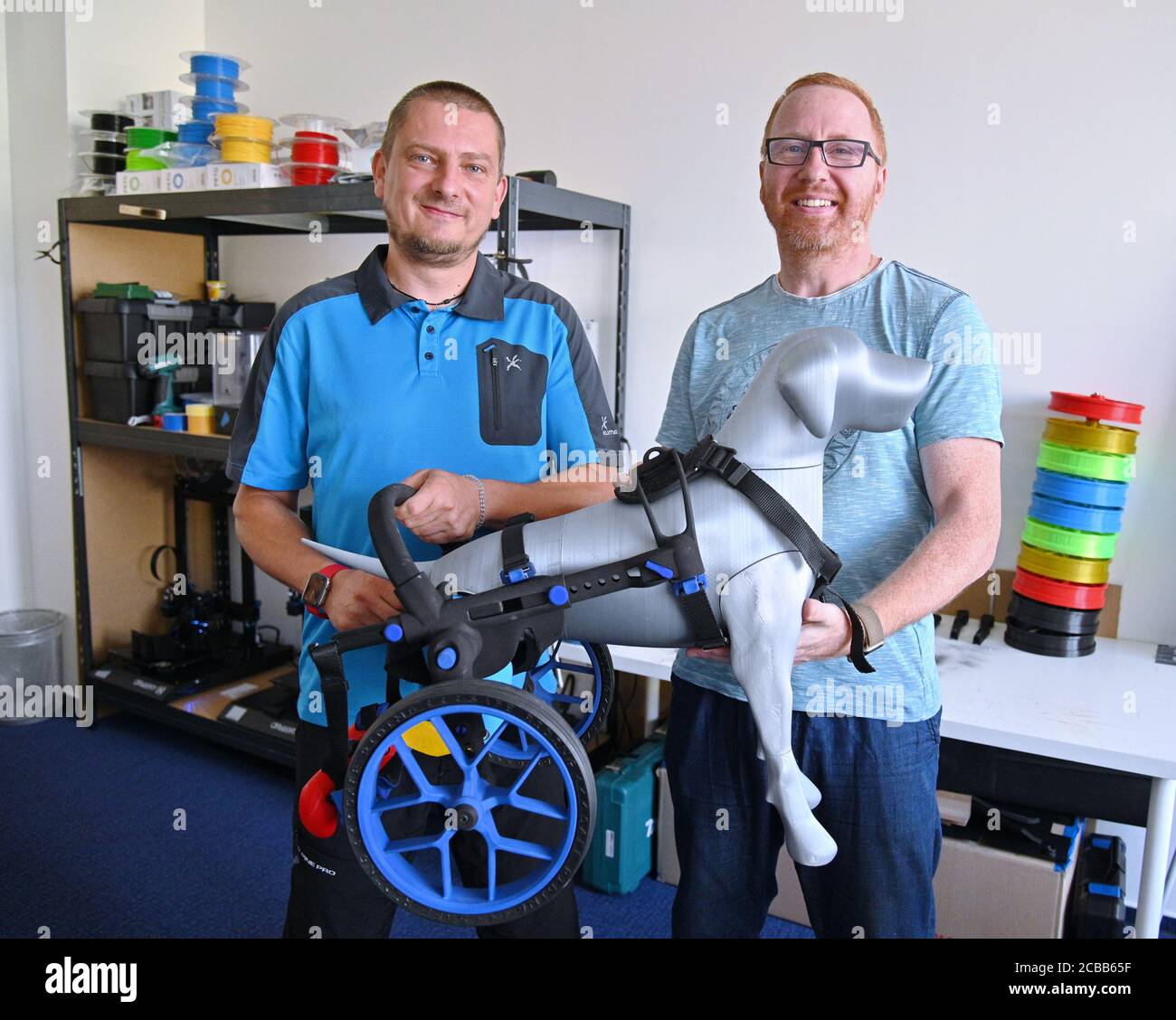 Brno, Czech Republic. 11th Aug, 2020. AnyOneGo, Czech company from Brno, manufactures prosthetics and wheelchairs for animals, most parts prints on 3D printers. On the photo co-founders of the company L-R Martin Schenk and Ivan Lukas show a wheelchair for a dog, on August 11, 2020, in Brno, Czech Republic. (CTK photo/Igor Zehl) Stock Photo