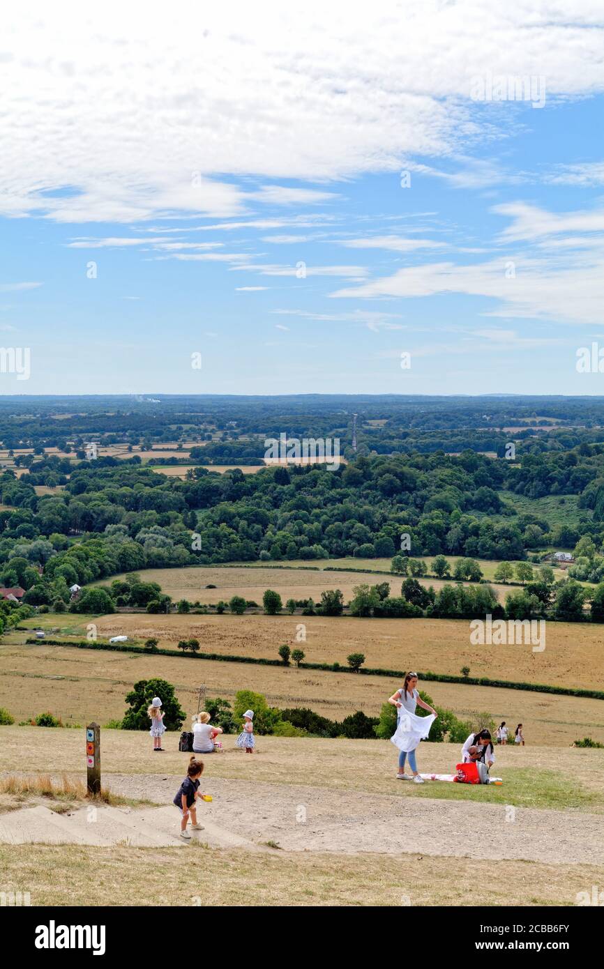 The view from the summit of a busy Box Hill looking across to the Weald on a summers day, Dorking Surrey England UK Stock Photo