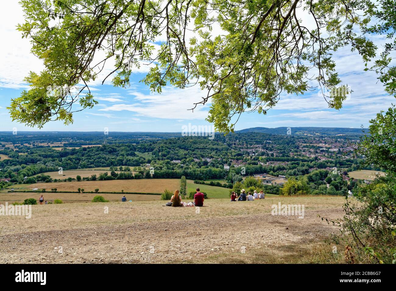 The view from the summit of a busy Box Hill looking across to the Weald on a summers day, Dorking Surrey England UK Stock Photo