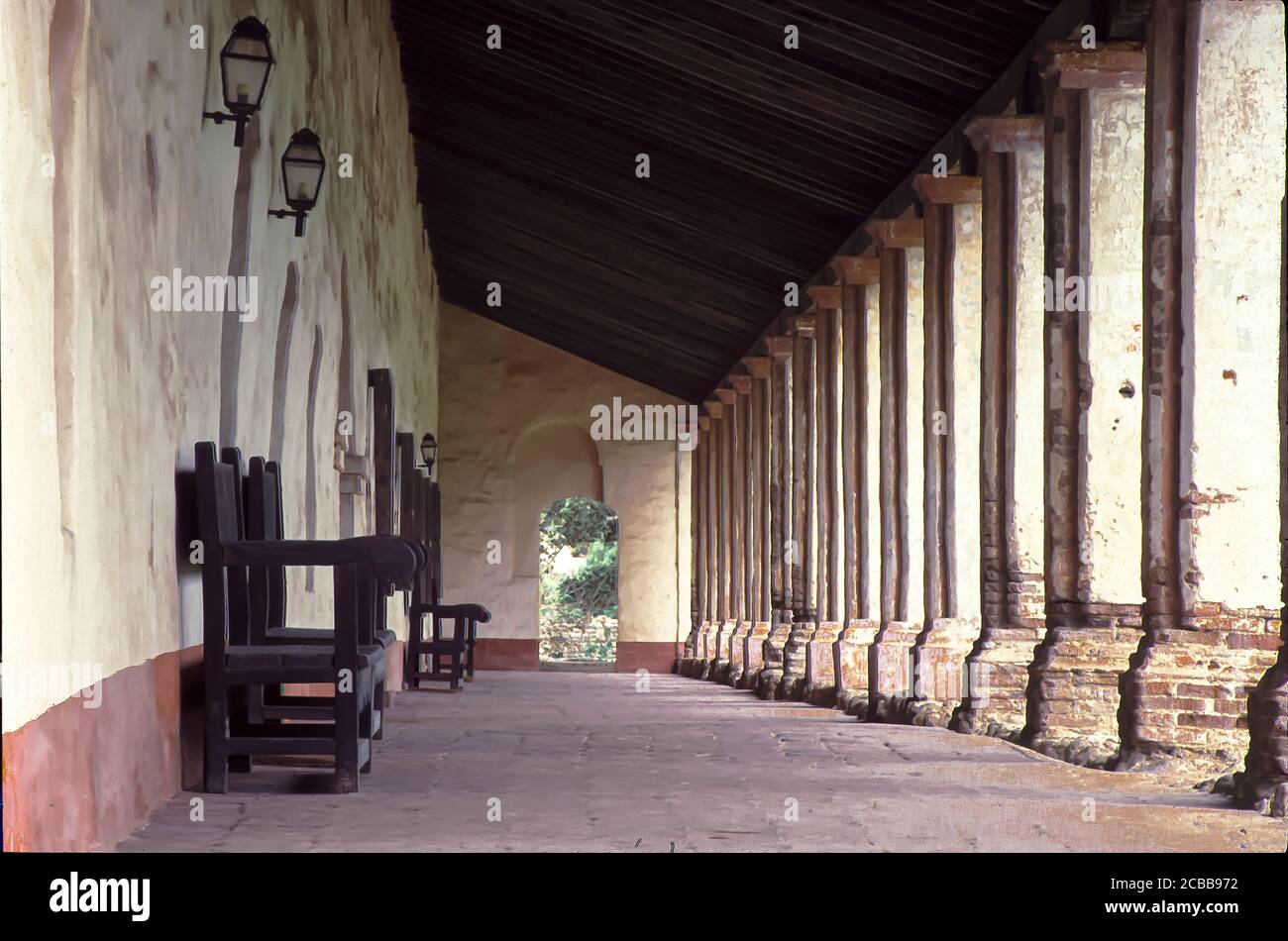 California mission hallway with columns with afternoon sun Stock Photo