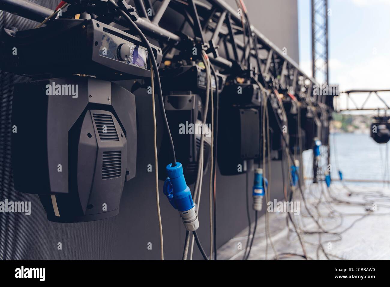 Installation of professional sound, light, led panel, video stage equipment for a concert. Stage lighting equipment is clamped on a truss for lift Stock Photo - Alamy