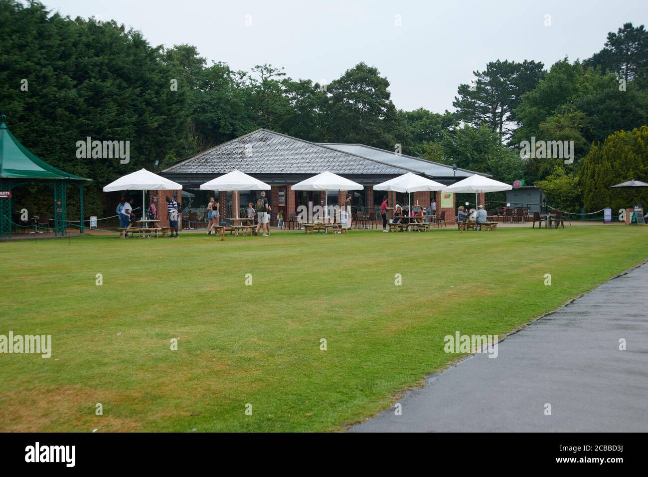 People eating outdoors during the corvid pandemic, in an English garden, East Yorkshire, England, UK, GB. Stock Photo