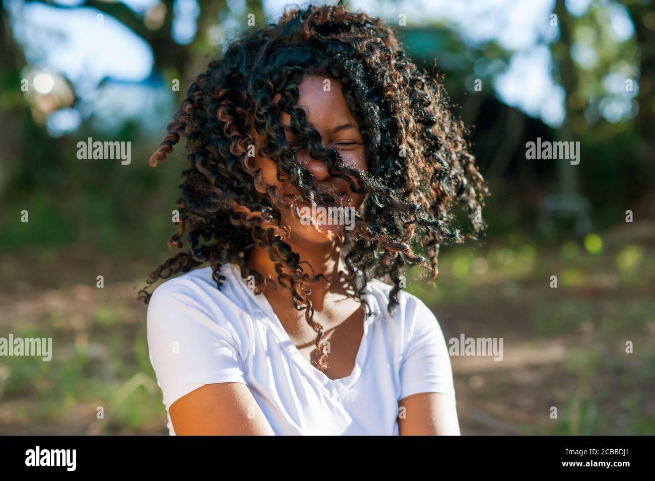 Young african girl playing and dancing in the nature Stock Photo