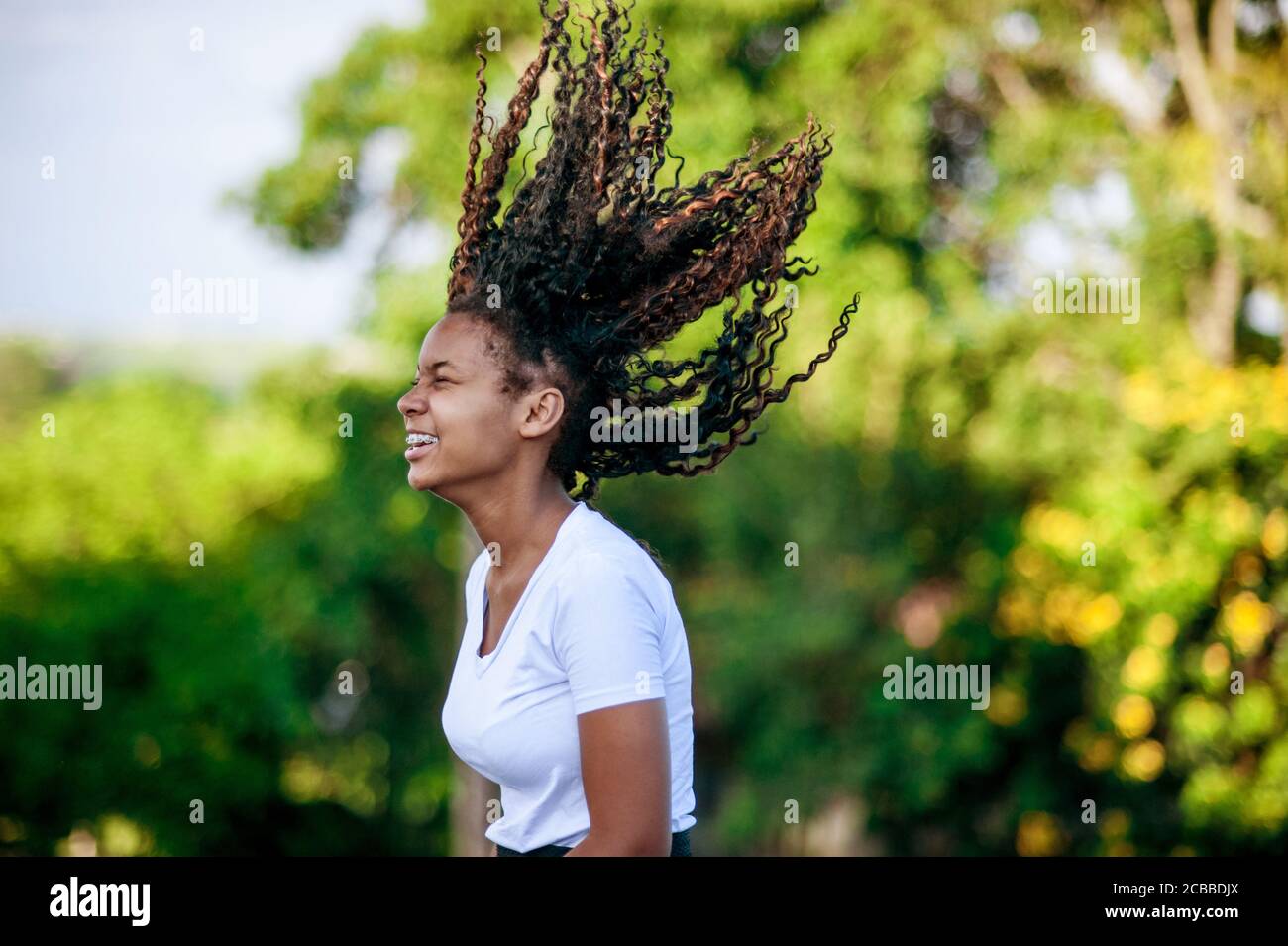 Young african girl playing and dancing in the nature Stock Photo
