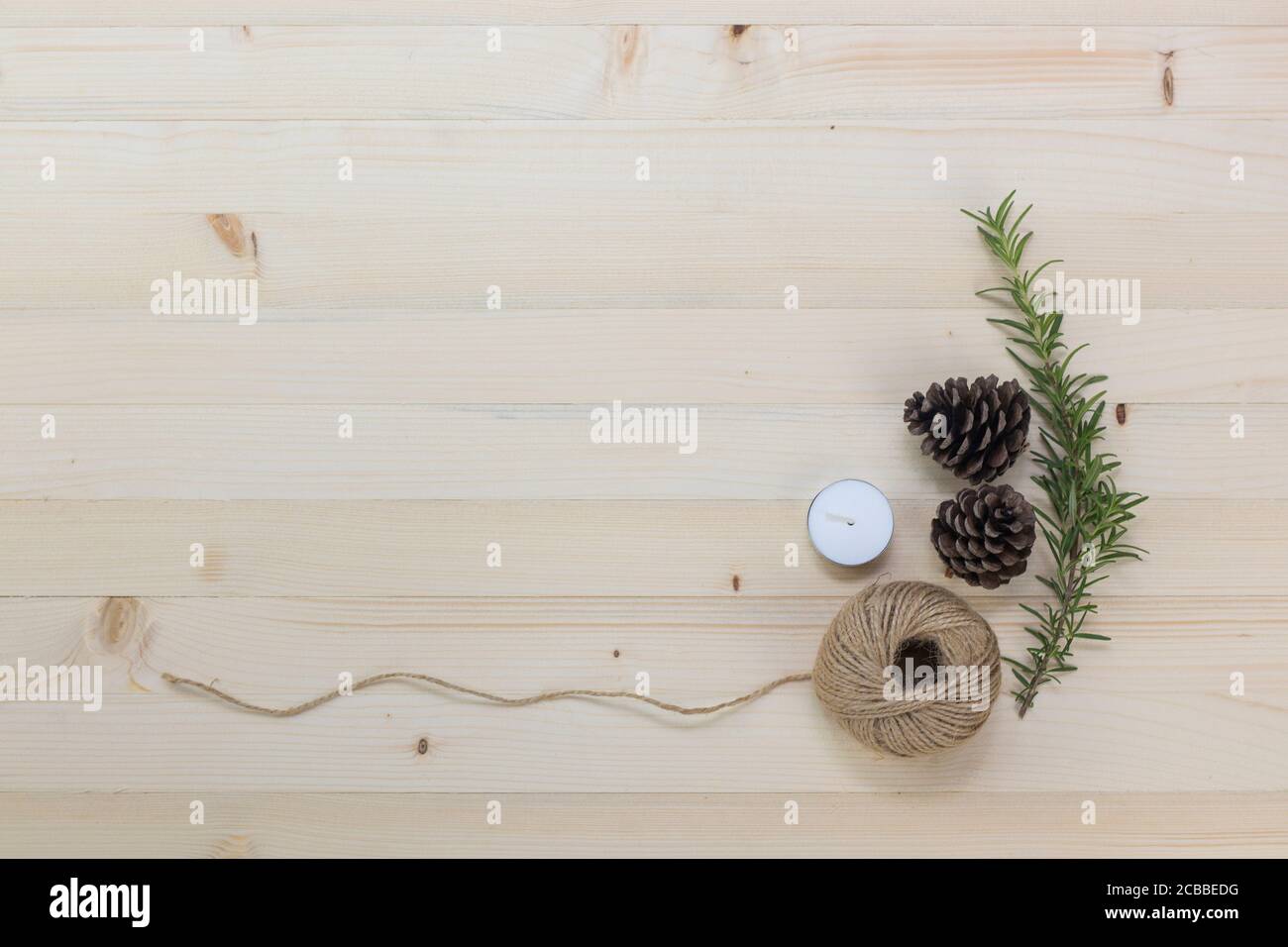 Ornaments for decorating the christmas tree placed on the pine wood background. Stock Photo