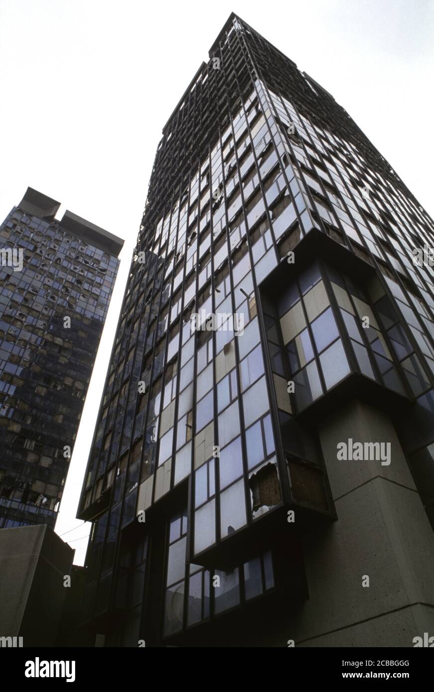 12th April 1994 During the Siege of Sarajevo: the bomb-damaged Unis Towers on Sniper Alley. Stock Photo