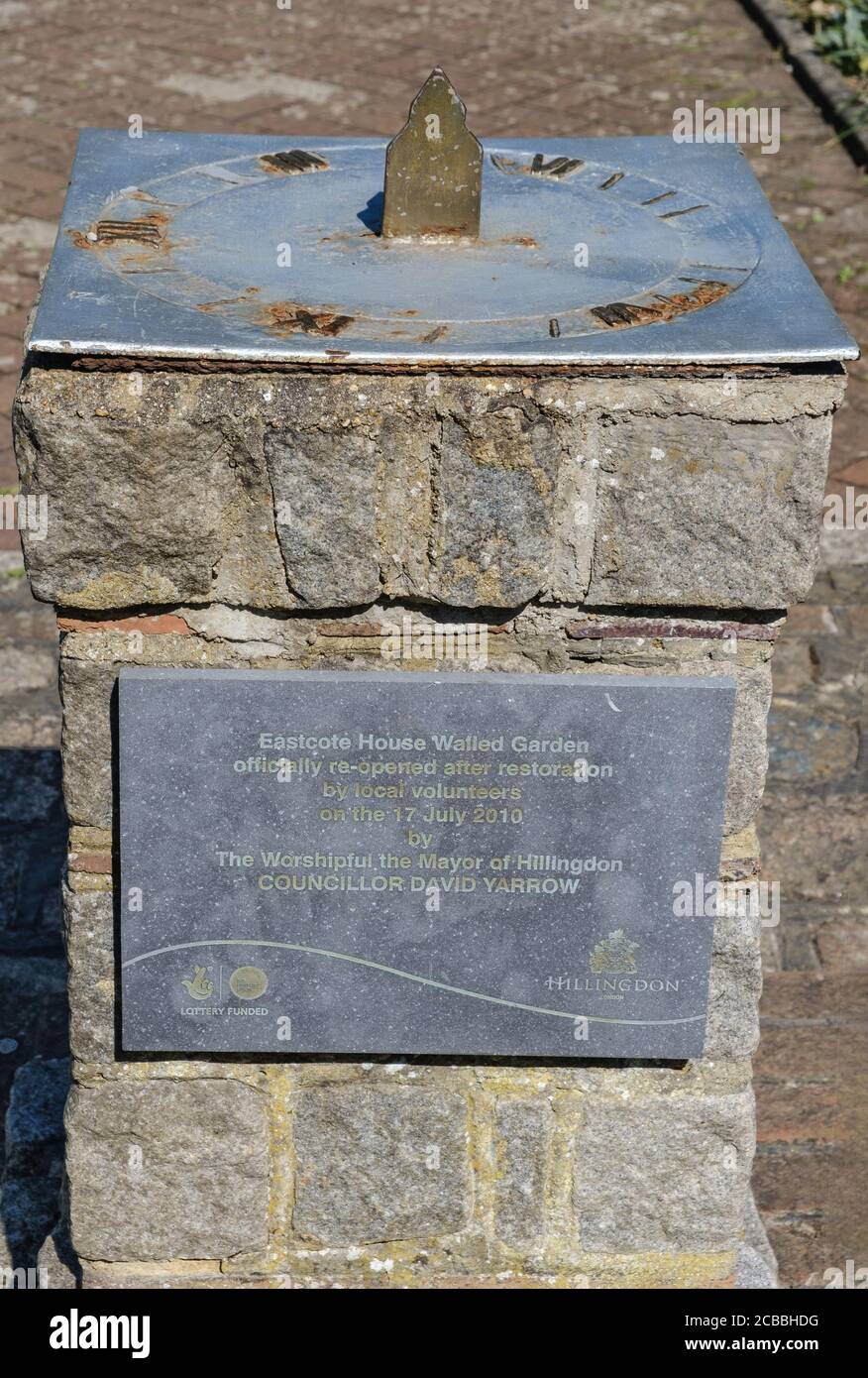 Sundial with plaque commemorating re-opening of Eastcote House Walled Garden after restoration by local volunteers in July 2010. Hillingdon, London. Stock Photo