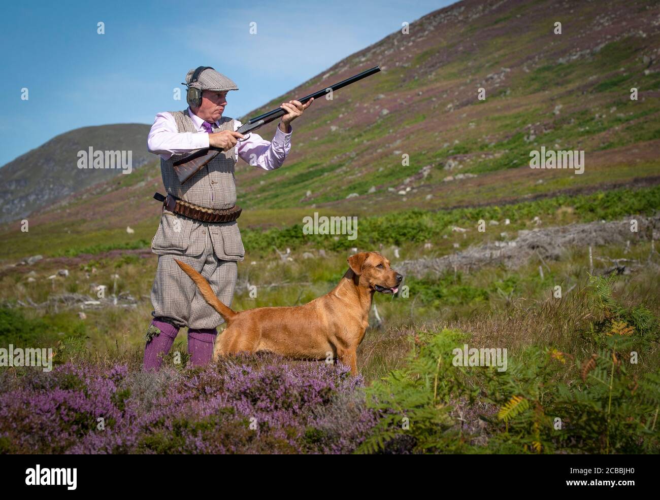 Members of a shooting party on the moors at the Rottal Estate in Glen Clova, near Kirriemuir, Angus, as the Glorious 12th, the official start of the grouse shooting season, gets underway. Stock Photo