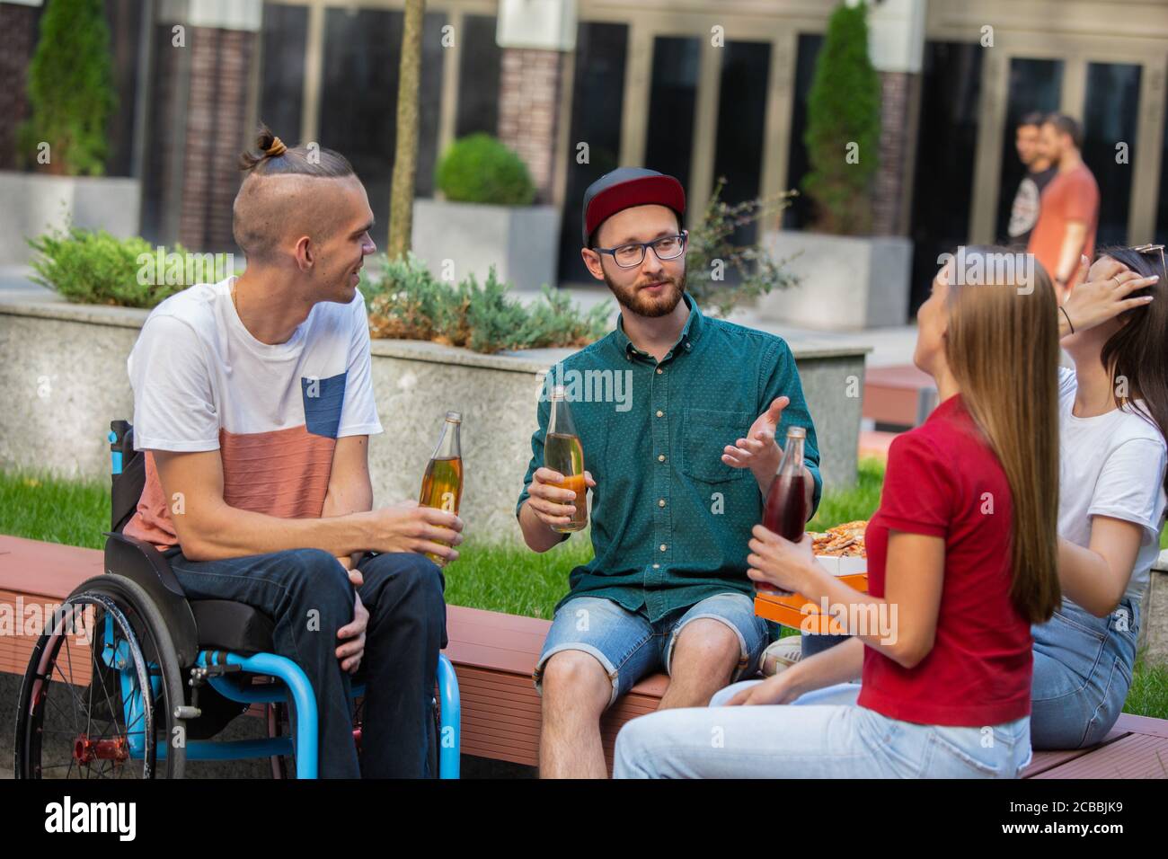 Friends talking fun wheelchair hi-res stock photography and images - Alamy