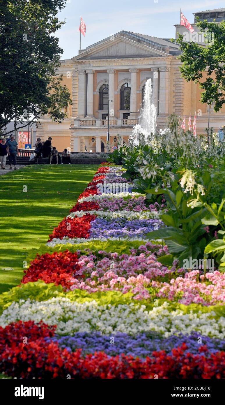 05 August 2020, Saxony-Anhalt, Halle (Saale): The green area in front of the opera house in Halle/Saale is in full bloom. The house was opened in 1886 with Friedrich Schiller's "Wallensteins Lager" and "Die Piccolomini". Photo: Hendrik Schmidt/dpa-Zentralbild/ZB Stock Photo