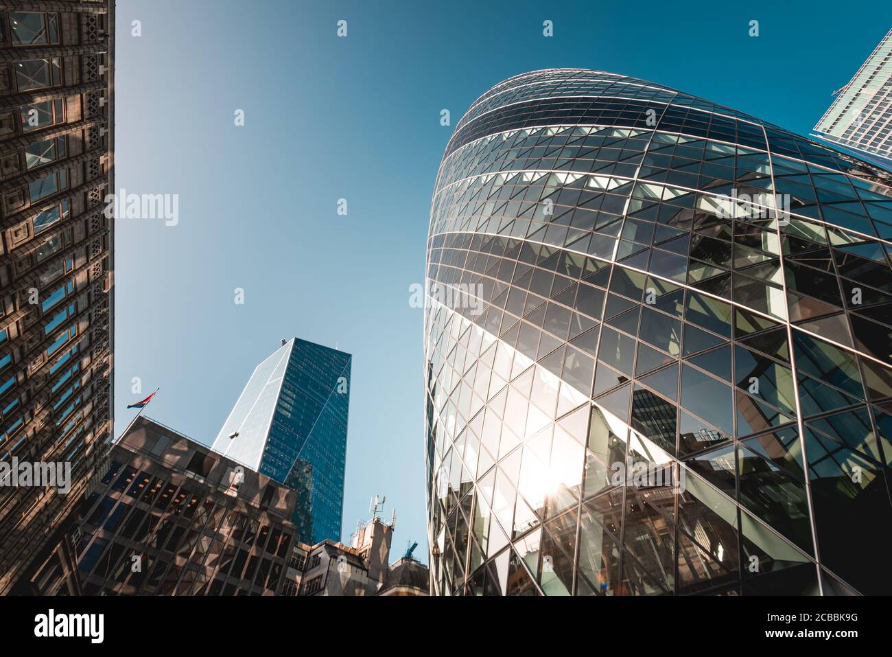 Modern architecture 30 St Mary Axe building, also known as the Gherkin, and is an Iconic building in the City of London business district Stock Photo