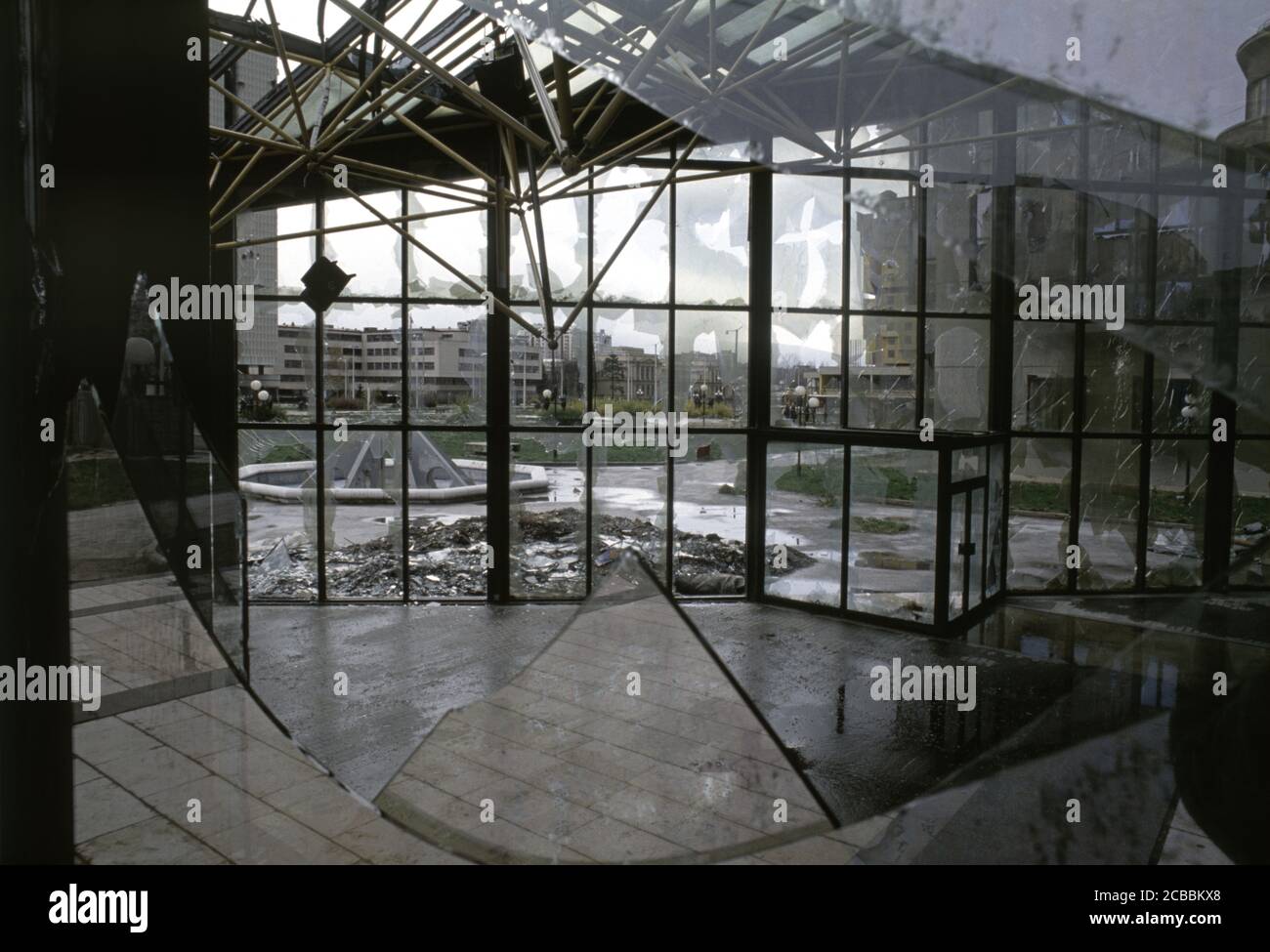 12th April 1994 During the Siege of Sarajevo: shattered windows in part of the Unis Towers complex. Stock Photo