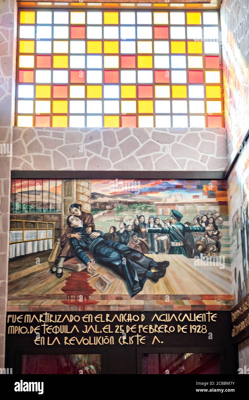 A mural depicting the martyrdom of Saint Toribio Romo in the Sanctuary of Santa Ana de Guadalupe, Jalisco State, Mexico. Father Toribio was a Mexican Catholic priest and martyr killed during the anti-clerical persecutions of the Cristero War and is considered the protector of migrants. Stock Photo