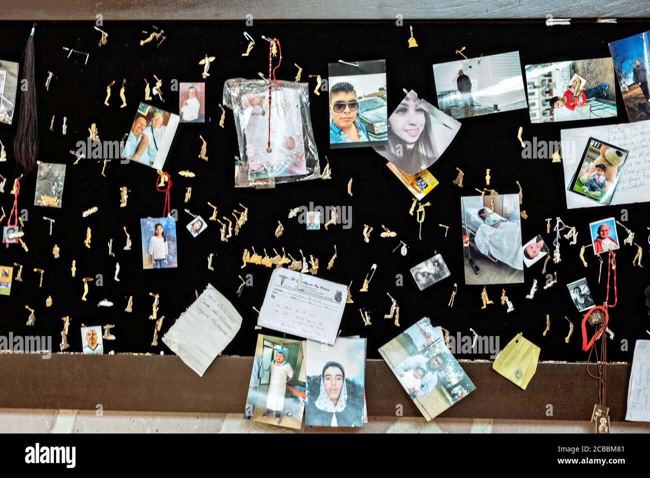 Mementos from believers left at the Sanctuary of Santa Ana de Guadalupe, Jalisco State, Mexico. The sanctuary honors Saint Toribio who was a Mexican Catholic priest and martyr killed during the anti-clerical persecutions of the Cristero War and is followed as the patron saint of migrants. Stock Photo