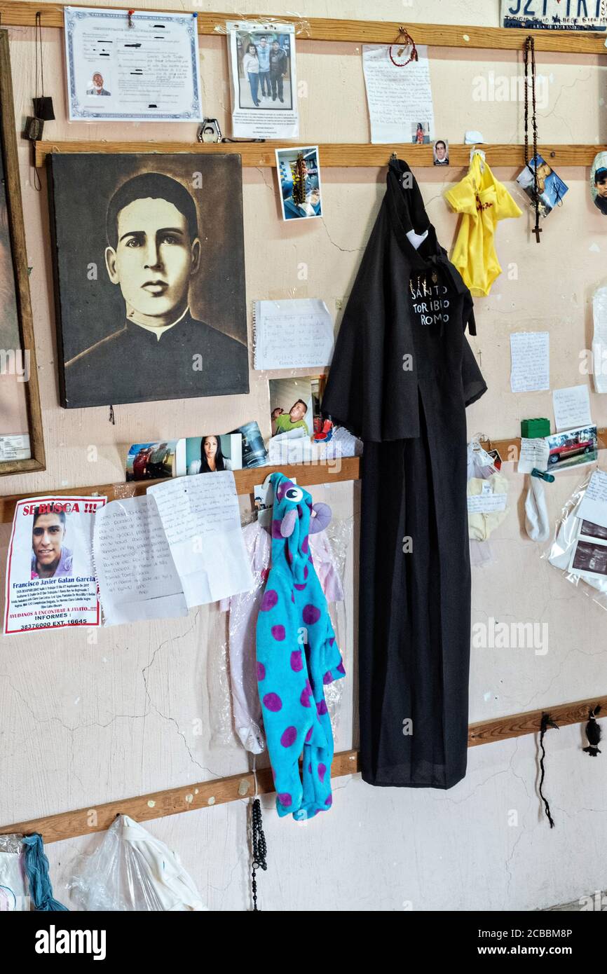 Mementos from believers left at the Sanctuary of Santa Ana de Guadalupe, Jalisco State, Mexico. The sanctuary honors Saint Toribio who was a Mexican Catholic priest and martyr killed during the anti-clerical persecutions of the Cristero War and is followed as the patron saint of migrants. Stock Photo
