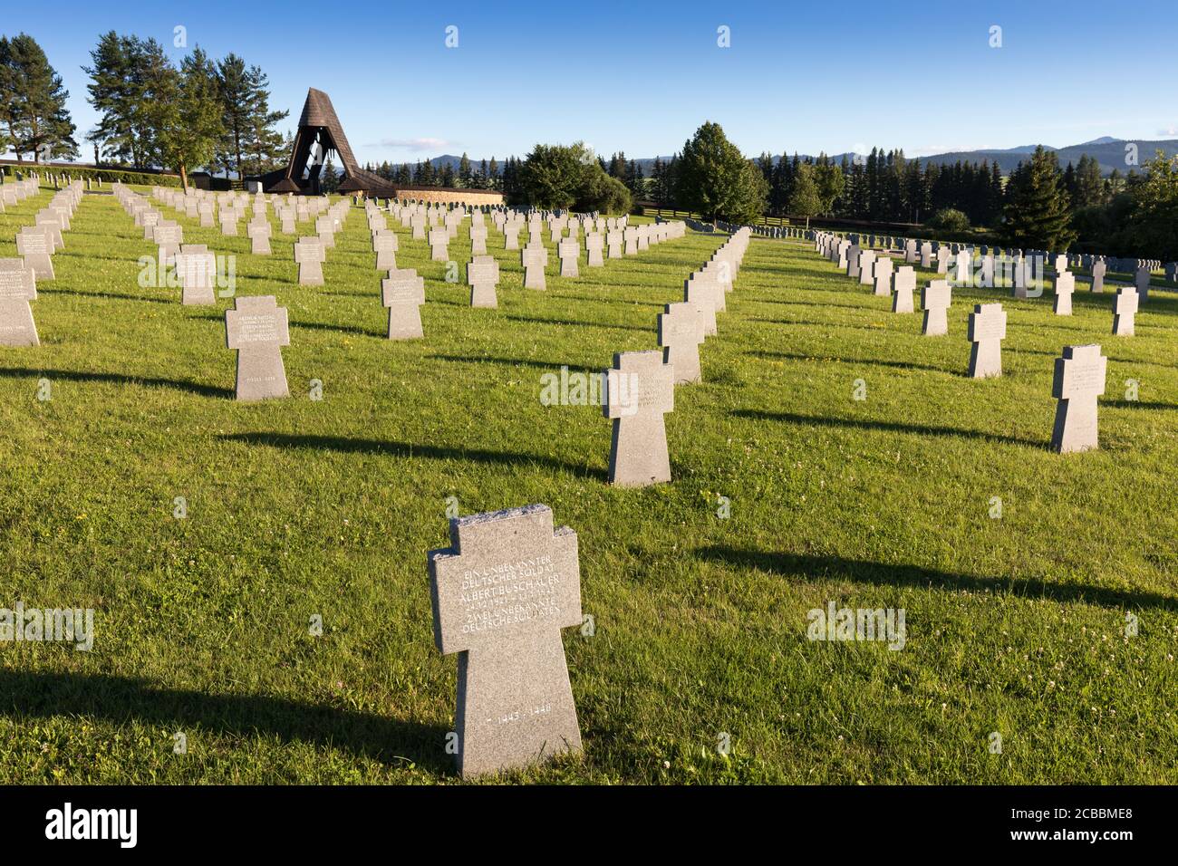 German military cemetery in autumn with mountains in the background and many graves of soldiers killed in the Second World War. Sunny day, Slovakia Stock Photo