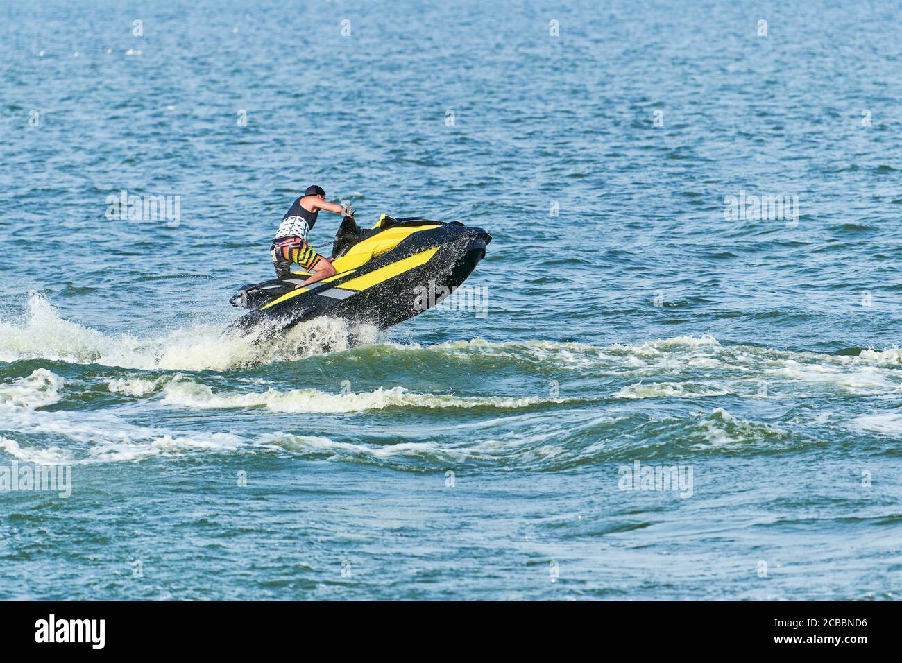 Man Water Rider Man on water scooter. Summer vacation on personal watercraft in ...