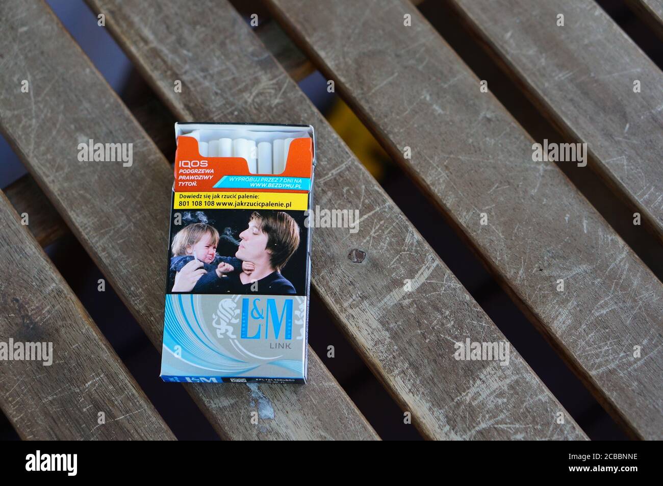 link cigarettes POZNAN, POLAND - Jul 29, 2020: L&M link cigarettes in a open box on a  wooden surface Stock Photo