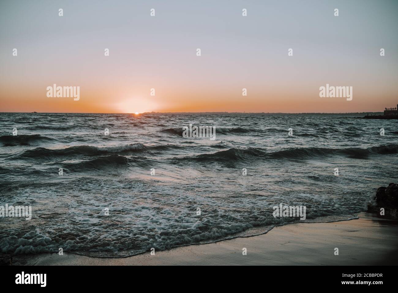 Amazing shot of a beautiful rocky beach during the sunset Stock Photo ...