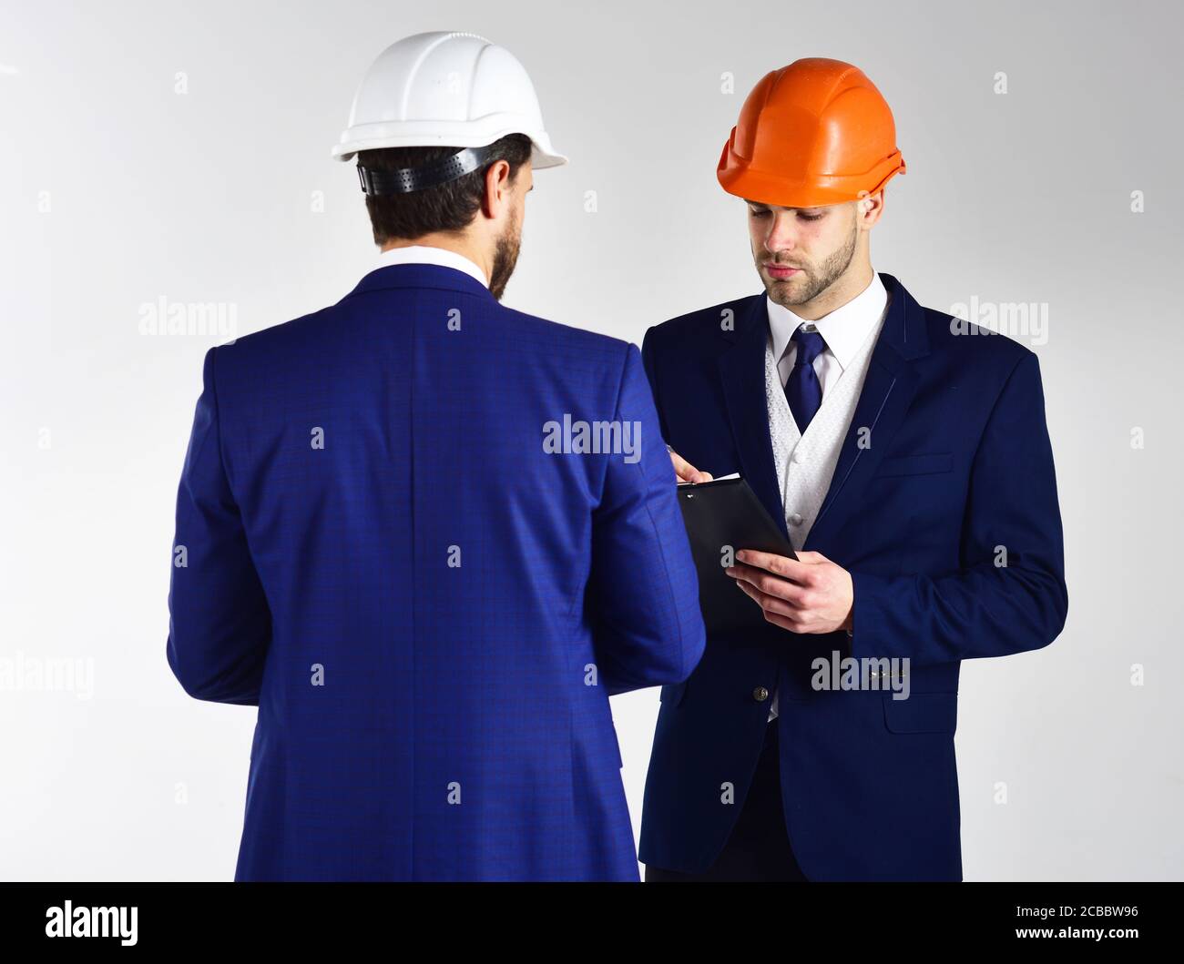Architects think about project. Engineers with serious faces. People in ...
