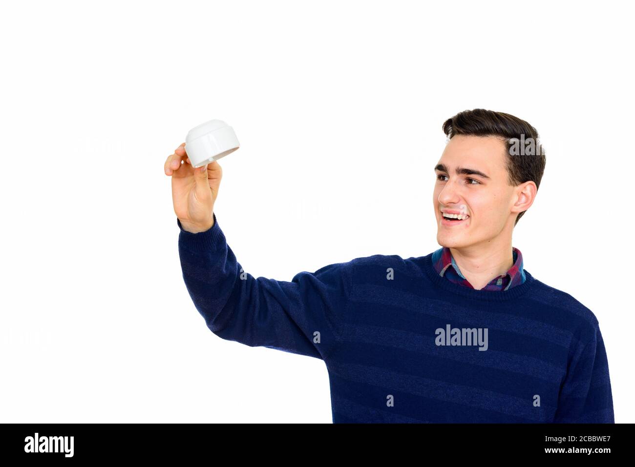 Portrait of happy young handsome man against white background Stock ...