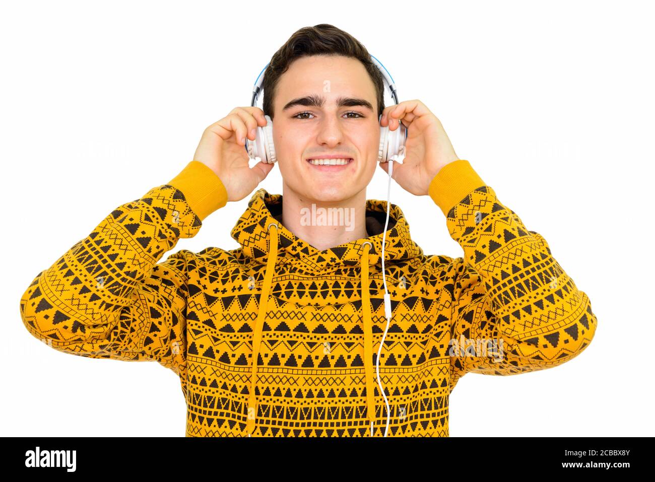 Portrait of happy young handsome man against white background Stock ...
