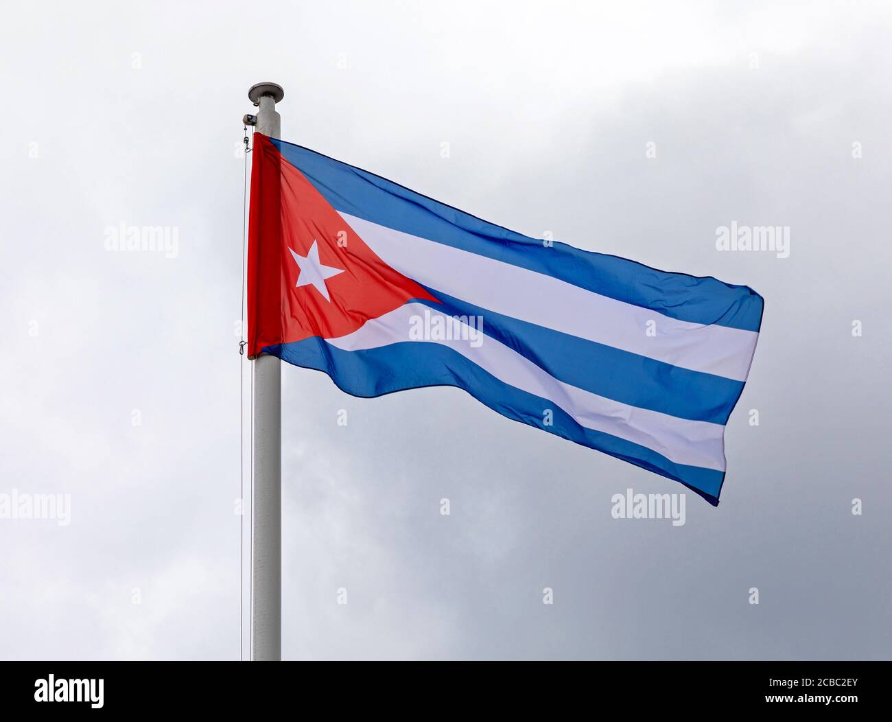National Flag of Republic Cuba at Cloudy Sky Stock Photo