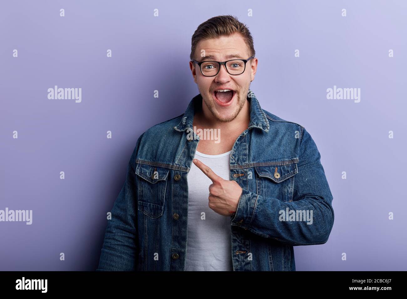 Attractive young man with open jacket hires stock photography and