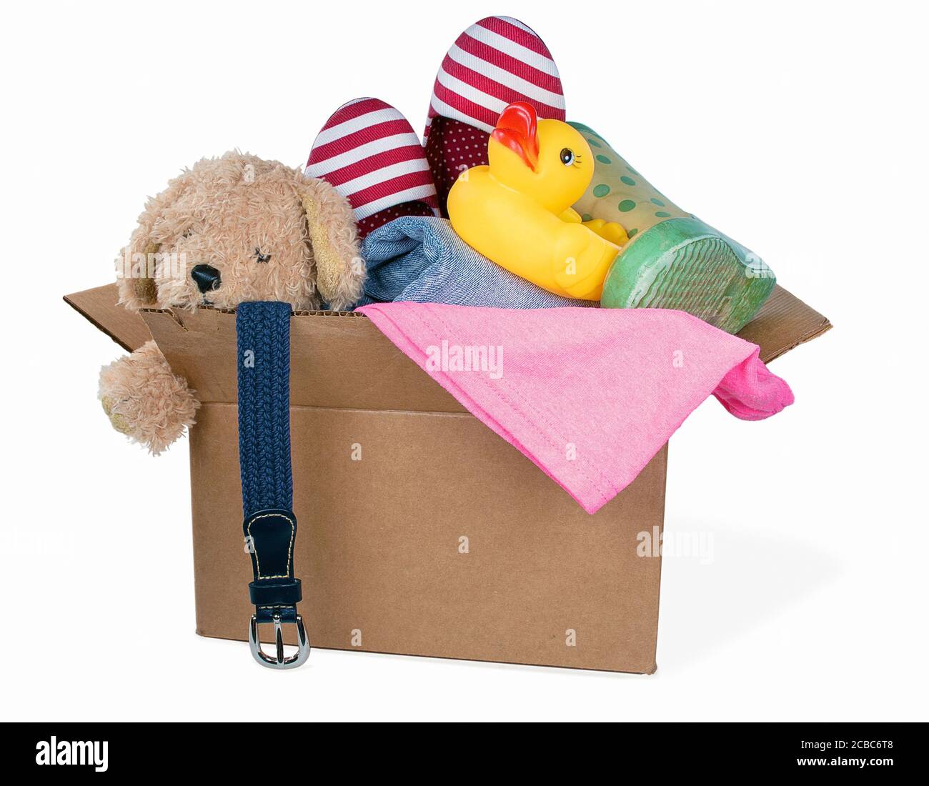cardboard box filled with donated items on white background Stock Photo