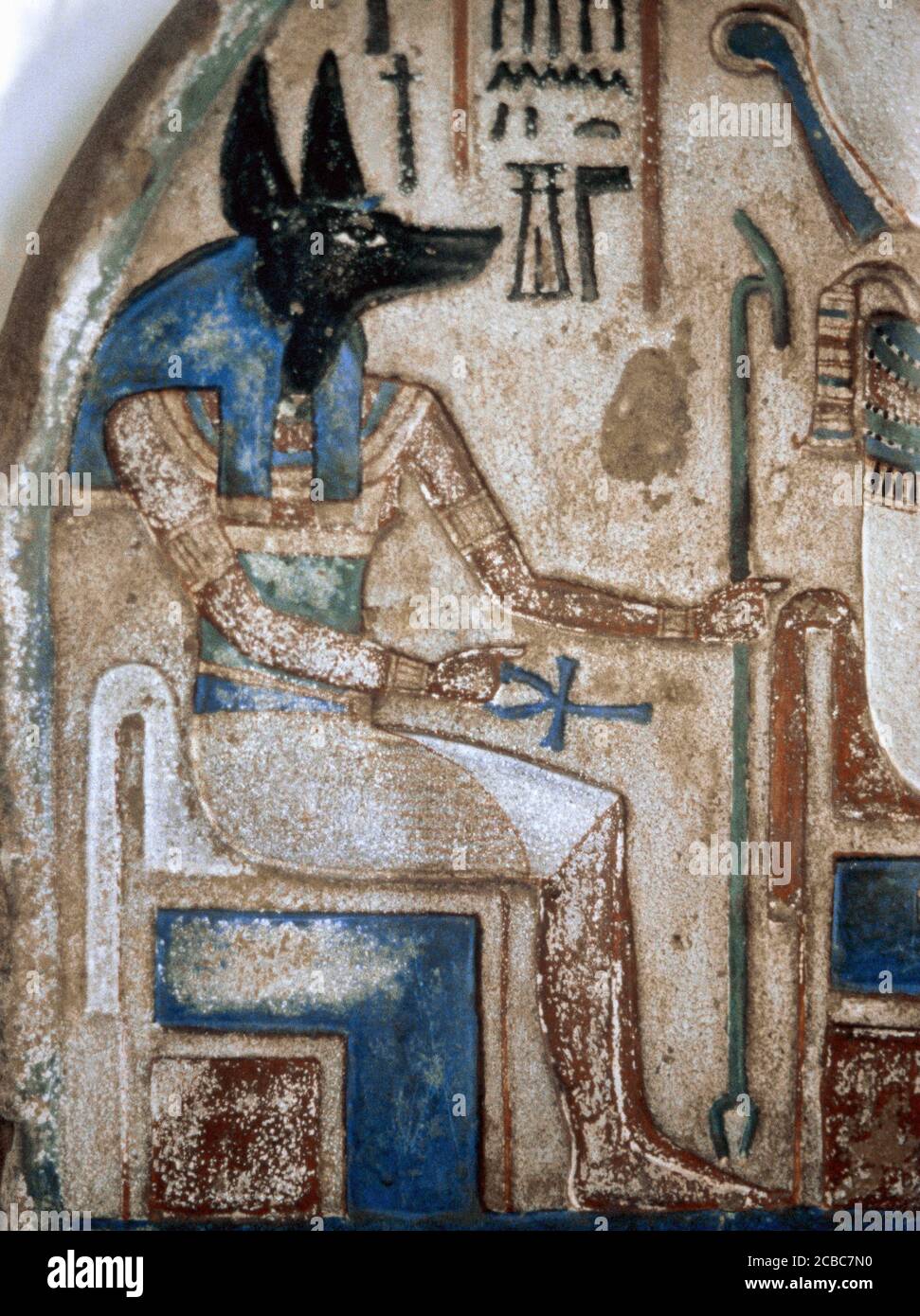Stele of Nanai. Detail with depiction of the god Anubis. Late 18th Dynasty. New Kingdom of Egypt. Calcareous and polychrome stone. The Egyptian Museum of Turin, Italy. Stock Photo